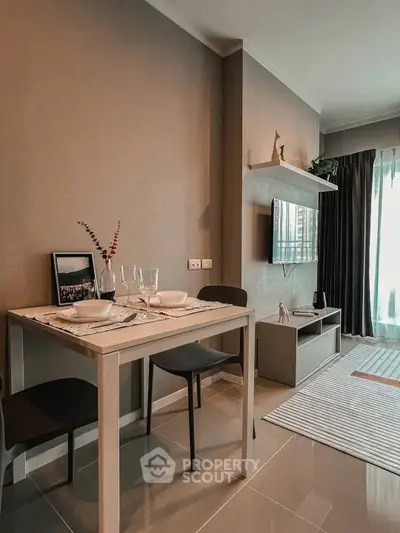 Modern living room with dining area, sleek furniture, and natural light for a cozy ambiance.