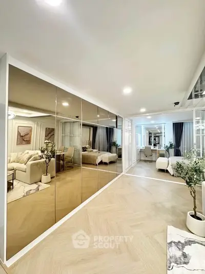 Spacious modern living room with mirrored wall and elegant decor