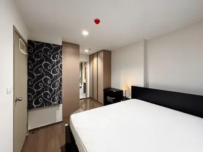 Modern bedroom with stylish decor and ample storage space