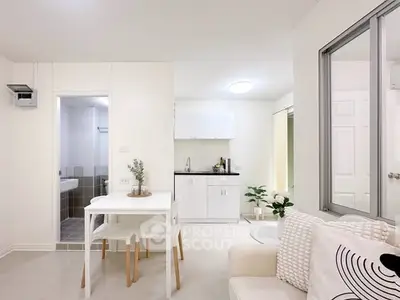 Modern open-plan living area with sleek kitchen and dining space