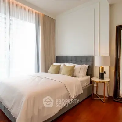 Elegant bedroom with modern decor and natural light