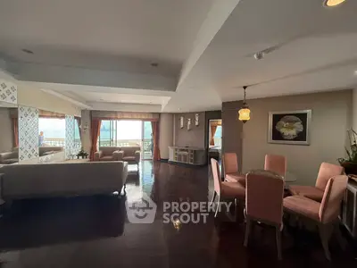 Spacious living room with elegant dining area and stunning ocean view