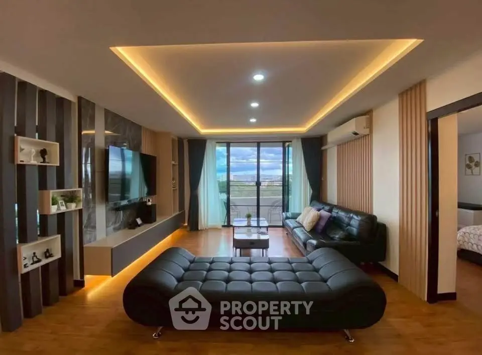 Luxurious modern living room with stylish furniture and ambient lighting, featuring a stunning view through large windows.