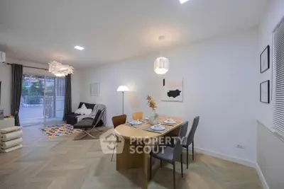 Modern living room with stylish dining area and cozy seating