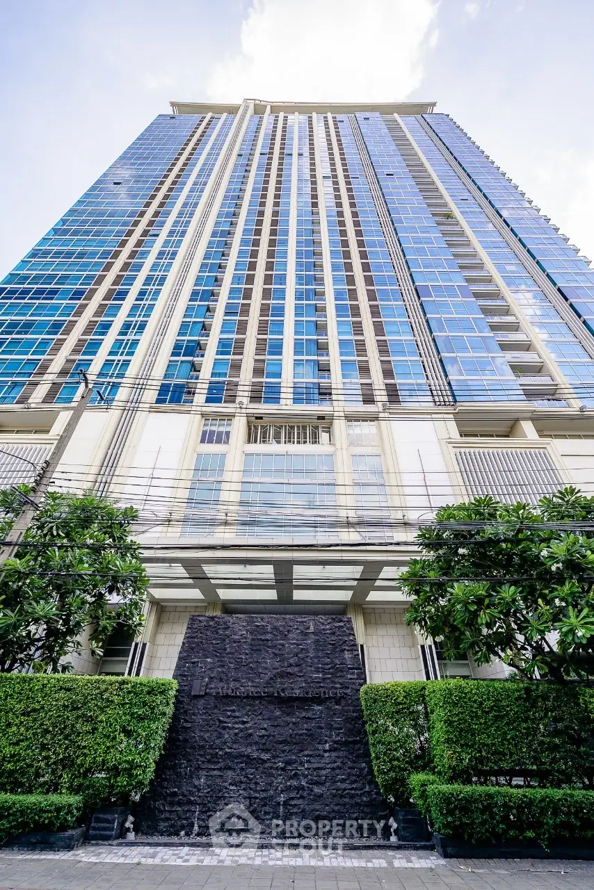 Stunning high-rise building with modern architecture and lush greenery