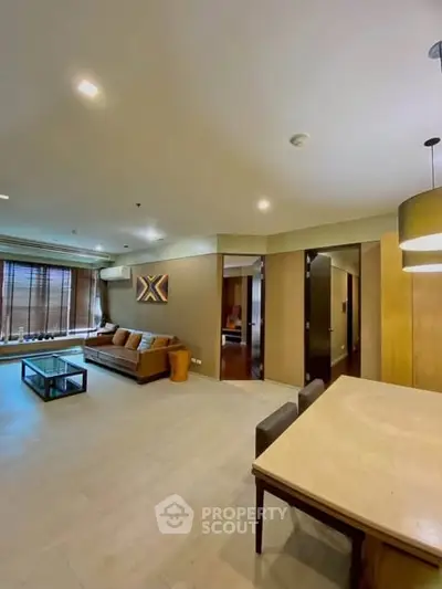 Spacious modern living room with elegant decor and ample natural light