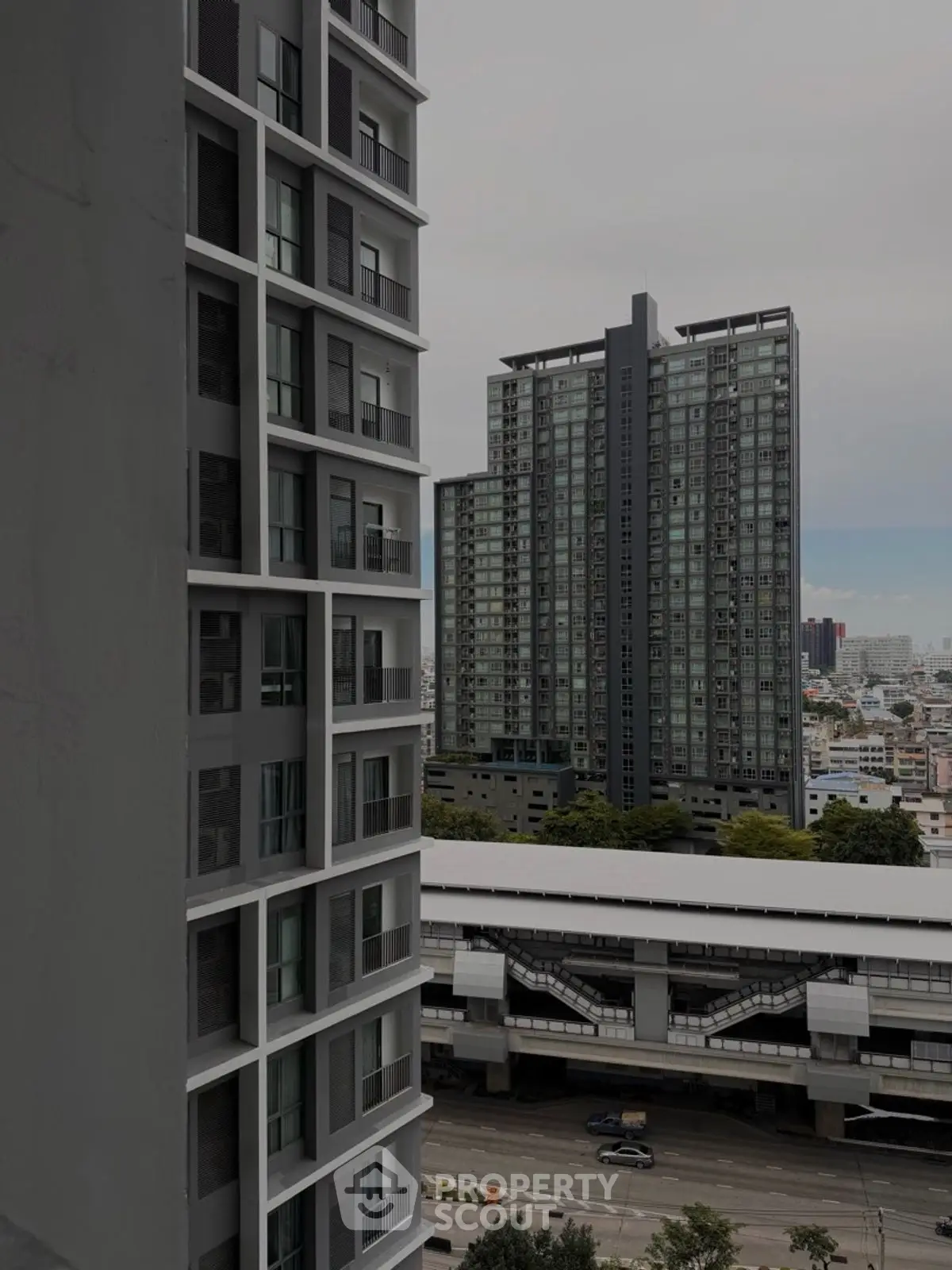 Urban high-rise buildings with cityscape view from balcony