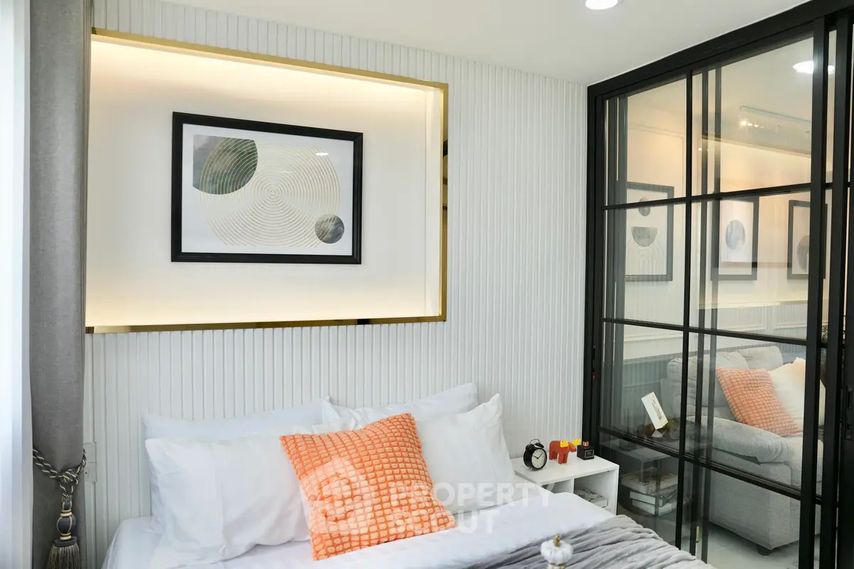 Modern bedroom with stylish decor and glass partition