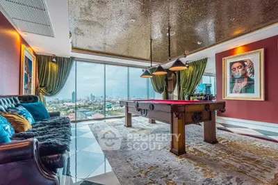 Luxurious living room with pool table and stunning city view