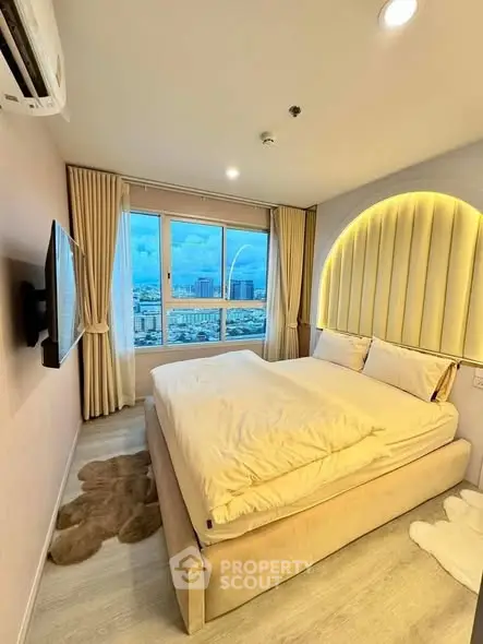 Luxurious bedroom with city view, modern decor, and ambient lighting