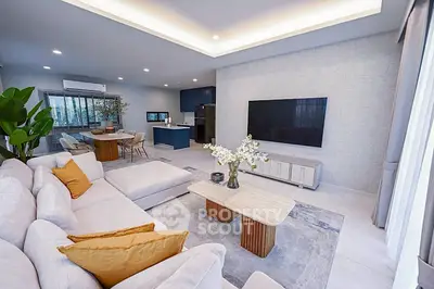 Spacious modern living room with elegant decor and open kitchen layout