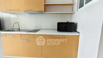 Modern kitchen with sleek cabinetry and built-in appliances, perfect for urban living.