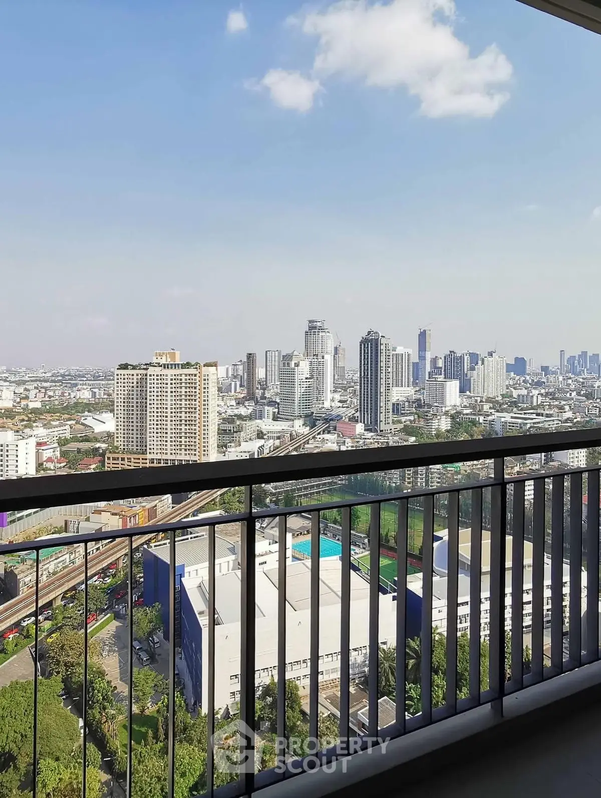 Stunning cityscape view from a high-rise balcony, perfect for urban living enthusiasts.