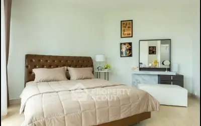 Spacious and elegant bedroom with modern decor and natural light