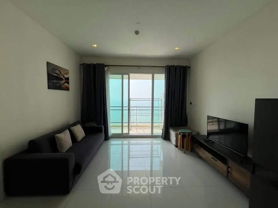 Modern living room with ocean view and sleek furnishings