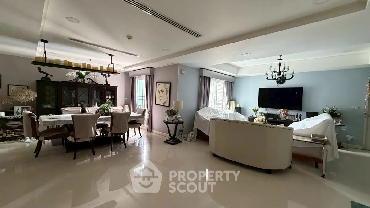 Spacious living and dining area with elegant decor and ample natural light