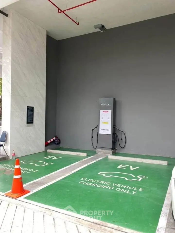 Modern electric vehicle charging station in a sleek parking area, perfect for eco-friendly living.