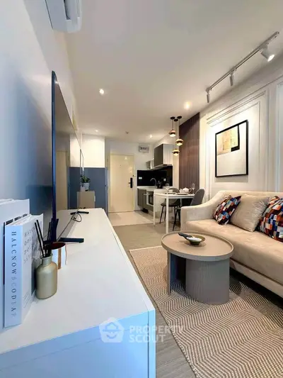 Modern living room with stylish decor and open kitchen layout, perfect for urban living.