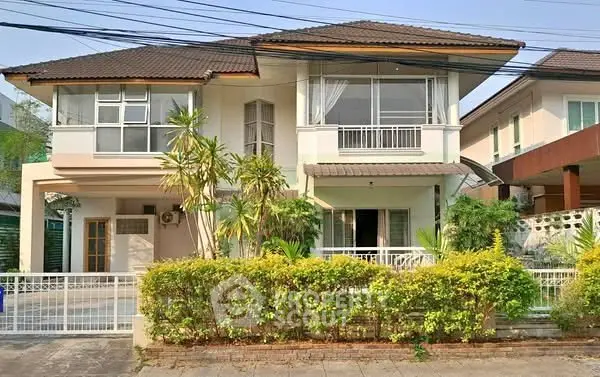 Charming two-story house with lush garden and modern design in a serene neighborhood.