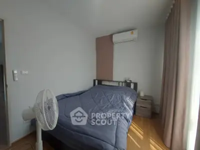 Cozy bedroom with air conditioning and modern decor, perfect for relaxation.