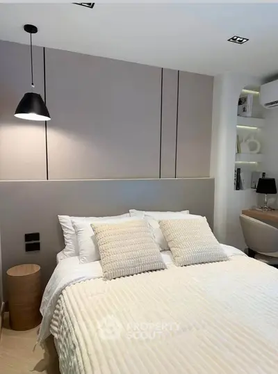 Cozy modern bedroom with stylish decor and soft lighting