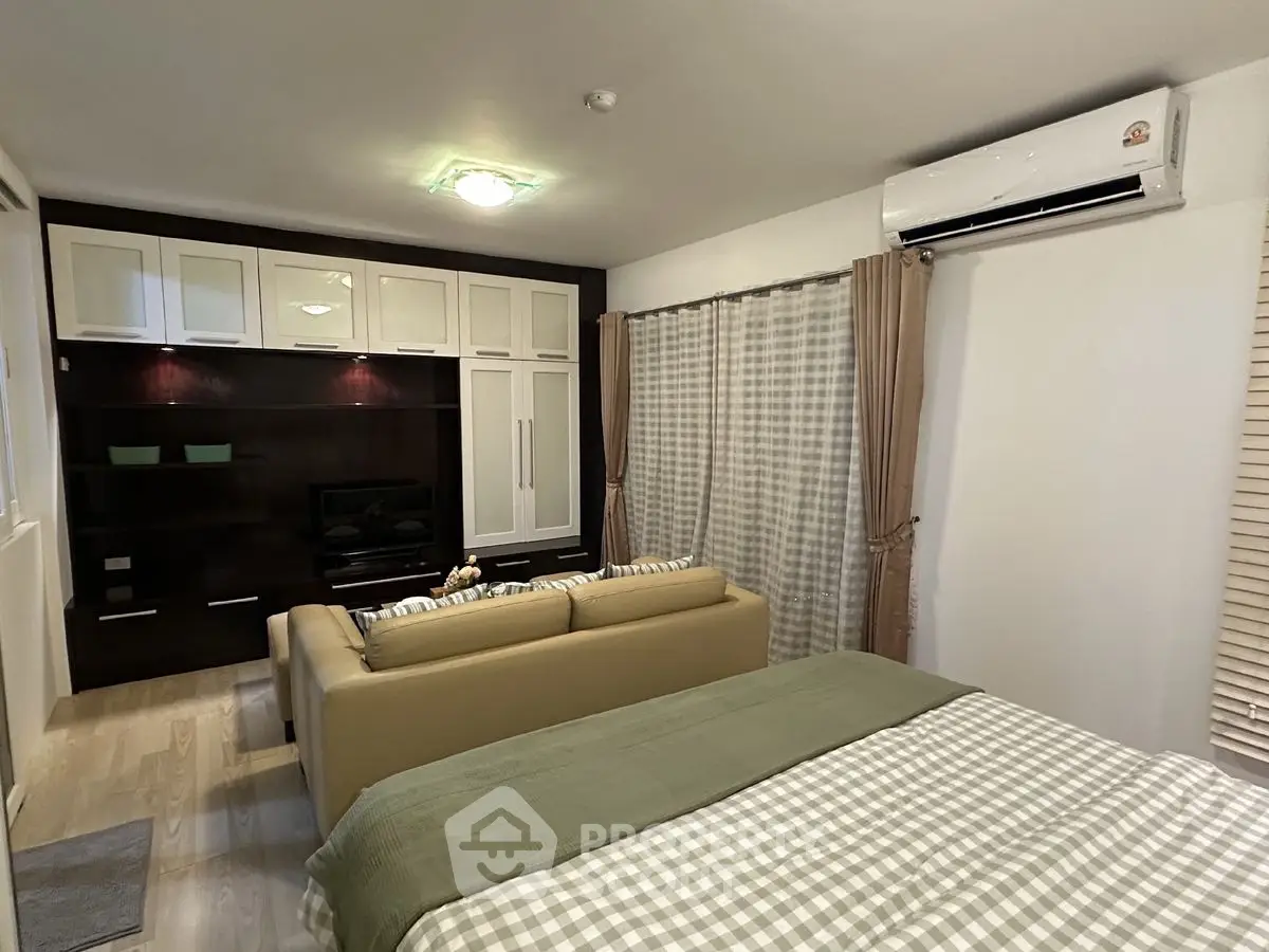 Cozy studio apartment with modern furnishings and air conditioning