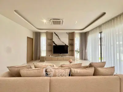 Luxurious modern living room with elegant decor and large windows