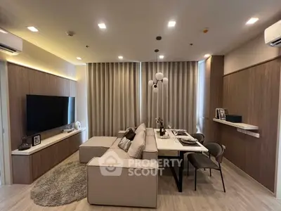 Modern living room with elegant dining area and stylish decor