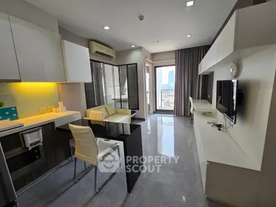 Modern living room with sleek design and city view, featuring open layout and stylish furnishings.