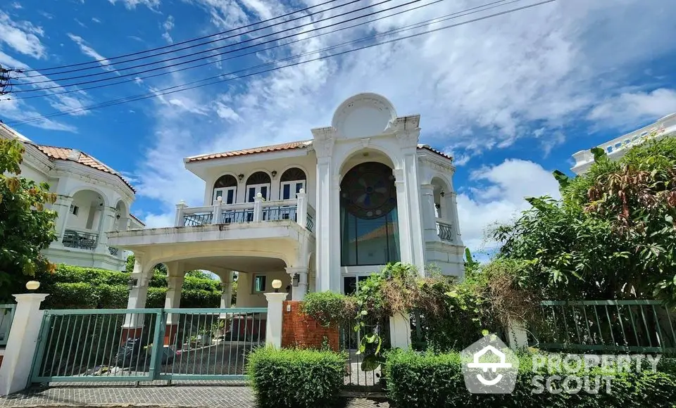 Stunning two-story villa with elegant architecture and lush garden in a serene neighborhood.