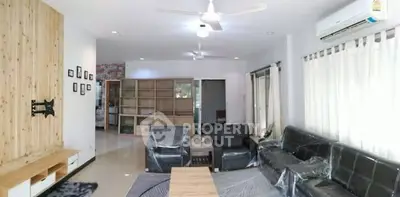 Spacious modern living room with sleek leather furniture and natural light