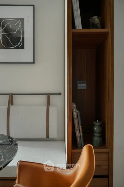 Stylish modern interior with elegant seating and wooden shelving, perfect for contemporary living spaces.