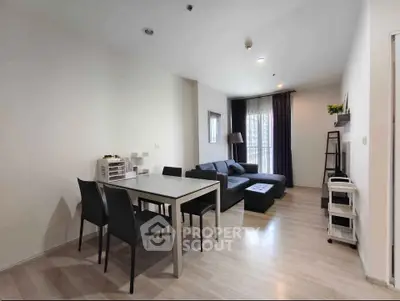 Modern living room with sleek furniture and natural light, perfect for urban living.