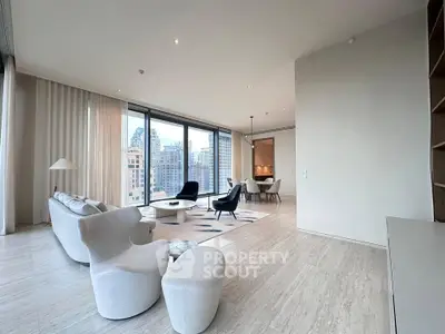 Luxurious modern living room with panoramic city views and elegant furnishings.