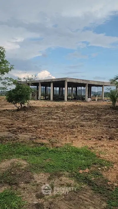 Explore this promising real estate opportunity with a partially constructed building on a spacious plot.