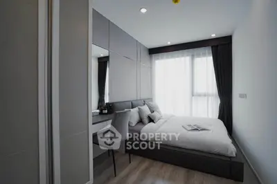 Modern bedroom with sleek design and ample natural light