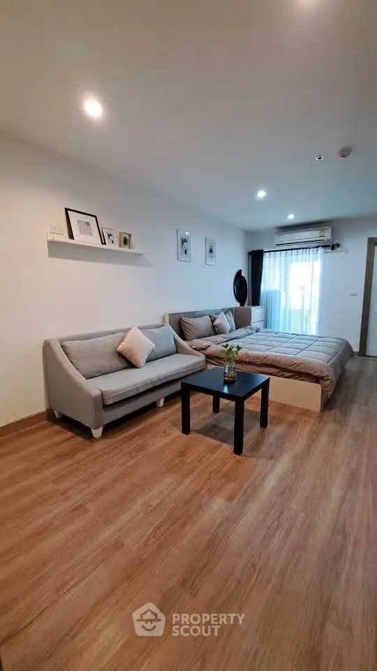 Modern living room with cozy sofa and stylish decor in a bright apartment.