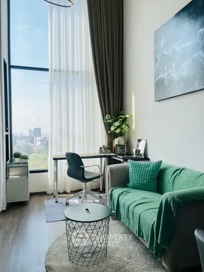 Modern living room with high ceiling and large window offering city view