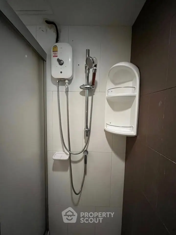 Modern bathroom with shower and water heater, sleek design for comfortable living.