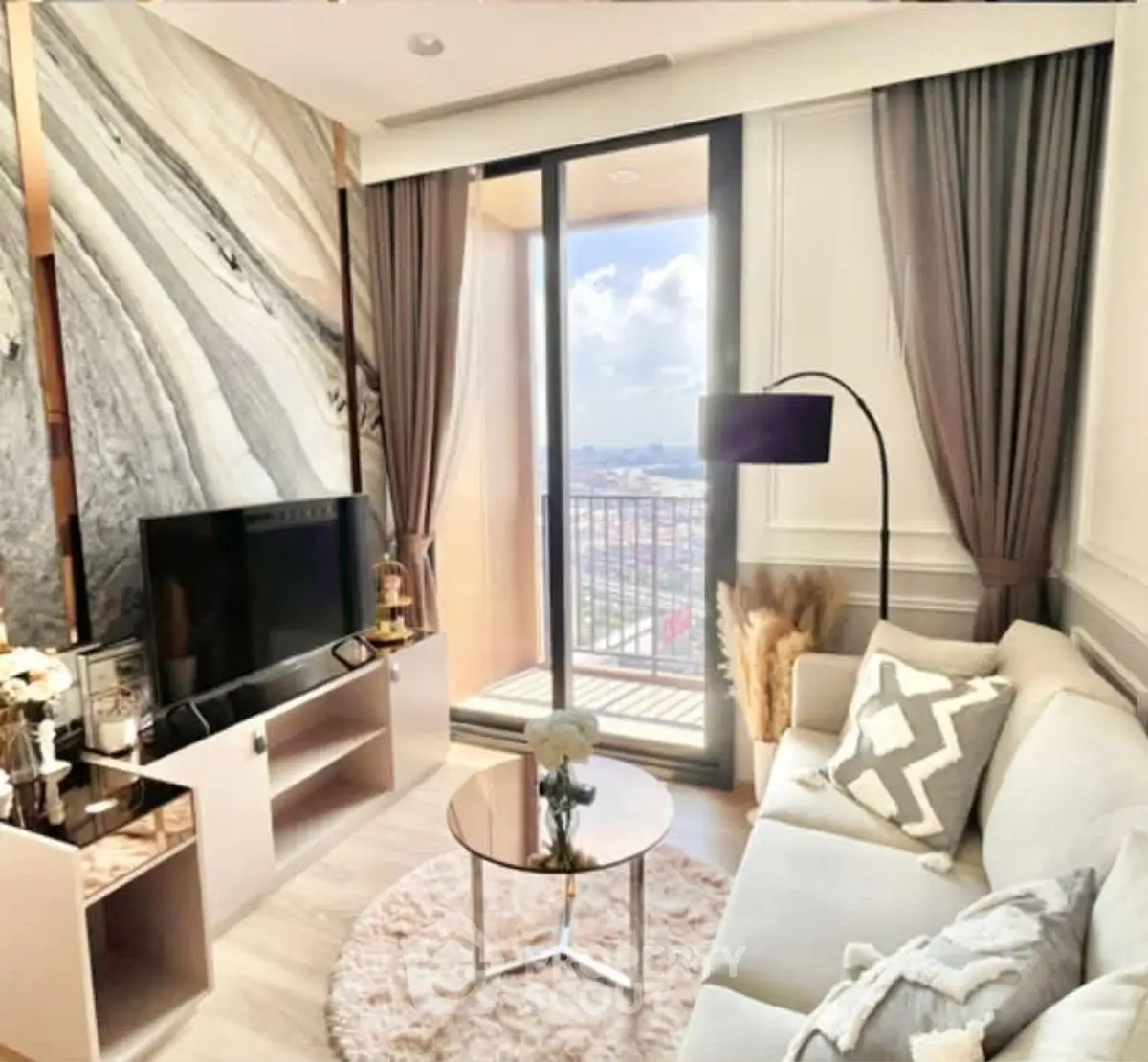 Stylish living room with modern decor and city view balcony