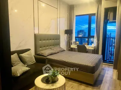Modern bedroom with city view, featuring stylish decor and cozy ambiance.