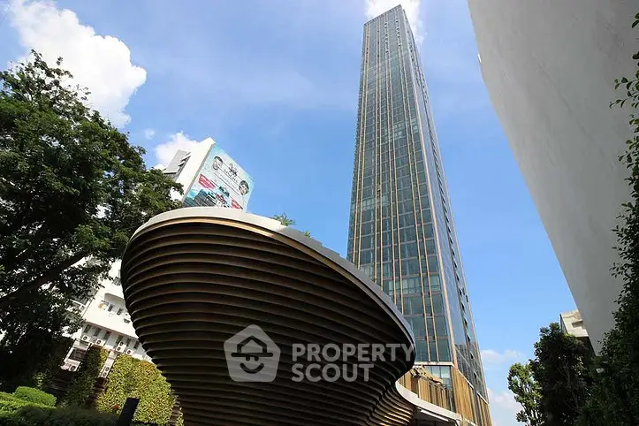 Stunning modern skyscraper with unique architectural design and lush greenery.