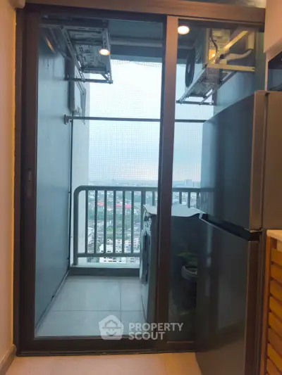 Modern apartment balcony with laundry area and city view