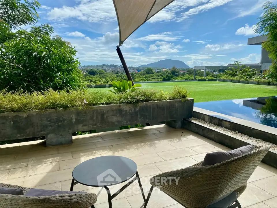 Luxurious patio with stunning mountain view and private pool, perfect for relaxation and outdoor enjoyment.