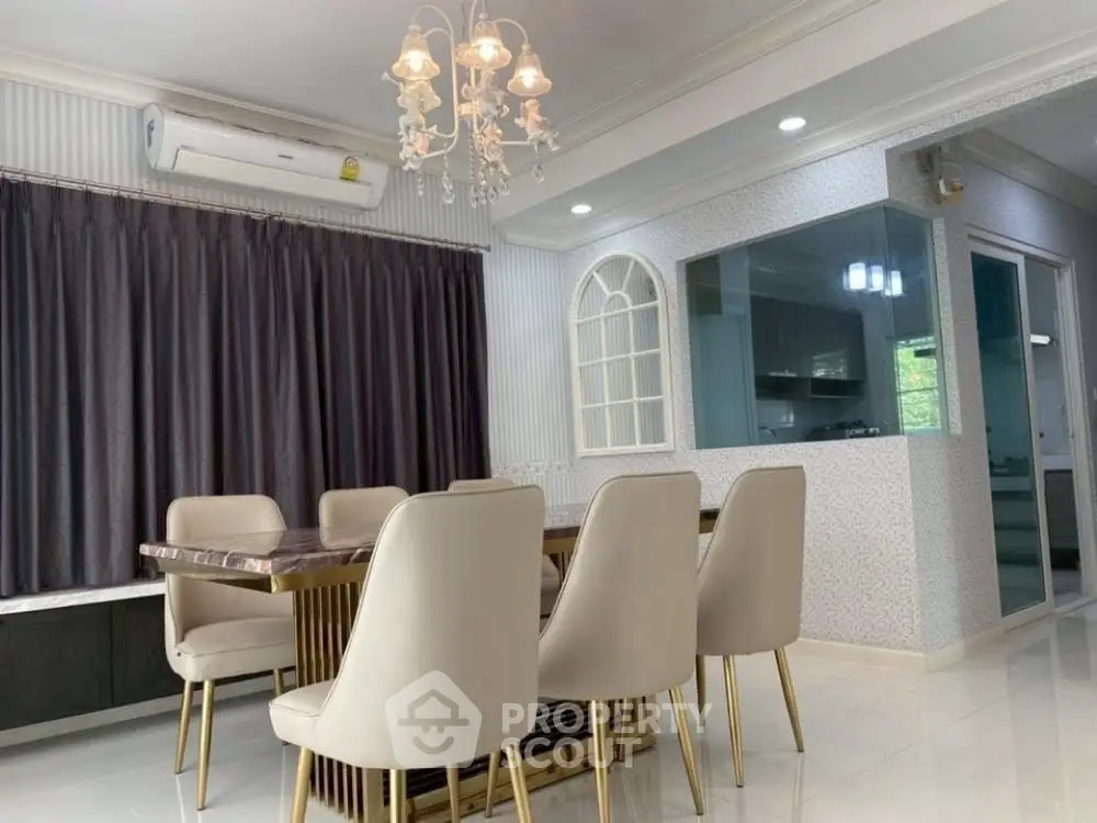 Elegant dining area with modern chandelier and stylish seating