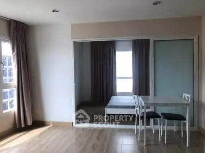 Modern apartment interior with minimalist dining area and bedroom view