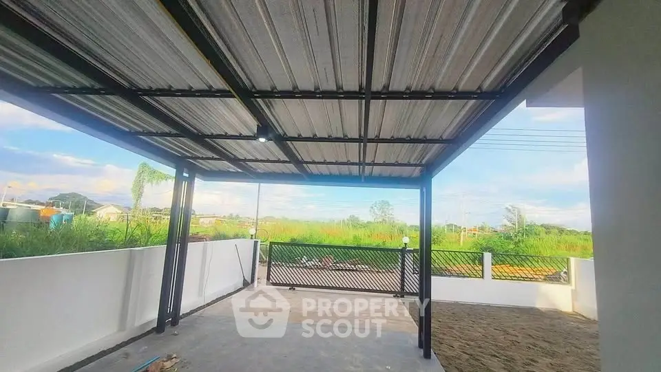 Spacious outdoor area with covered patio and scenic view, perfect for relaxation and gatherings.