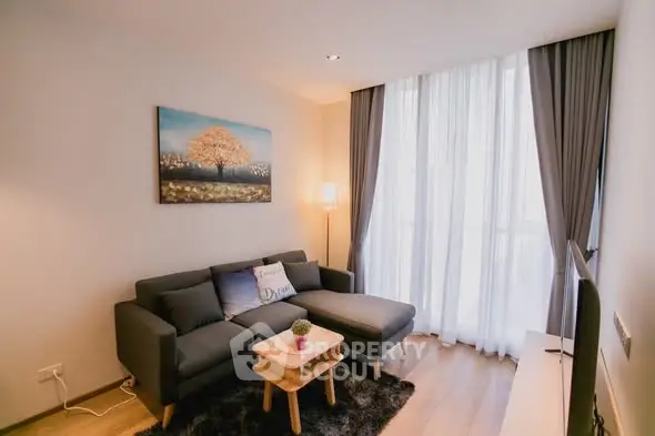 Cozy living room with modern sofa and large window for natural light