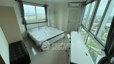 Modern bedroom with panoramic city view and sleek furnishings