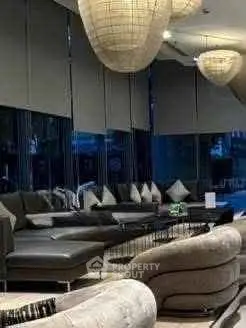 Luxurious modern living room with stylish furniture and ambient lighting